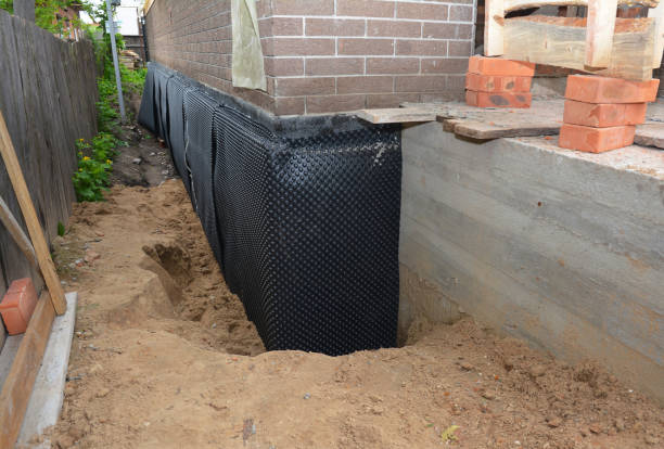 Happy homeowners after waterproofing job in Anna